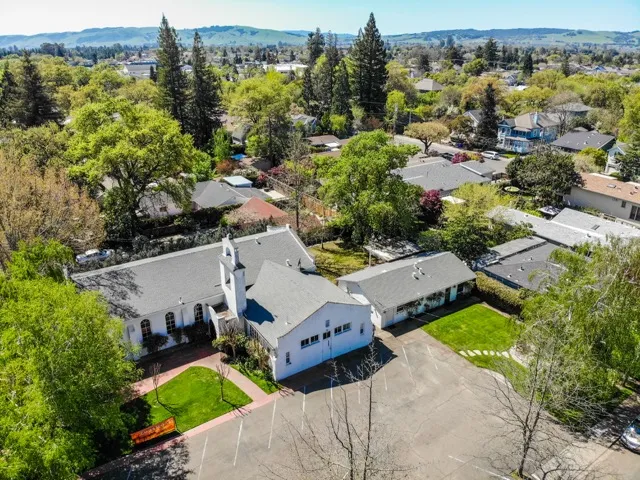 Aerial view of Sonoma Valley Community Church surrounded by the town of Sonoma and the valley hills