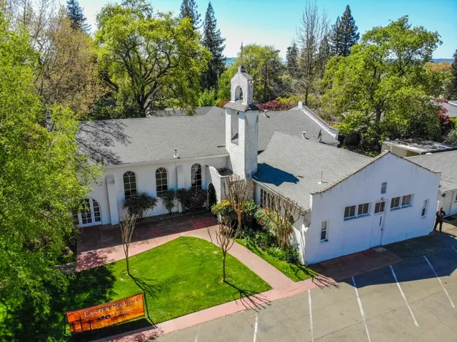 Aerial view of Sonoma Valley Community Church on Chase Street with the Sonoma Valley hills beyond