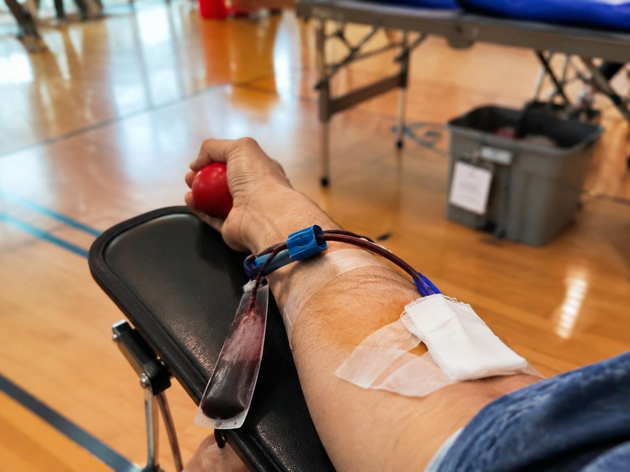 Illustrative photo of a volunteer donating blood at a community blood drive